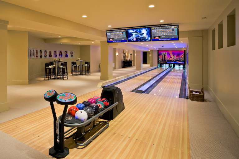 A two lane bowling alley inside a home.